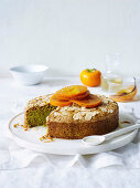 Pistachio and almond cake with poached persimmons