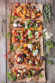 Pizza with pear, biltong, tex-mex mix, beetroot and aubergine