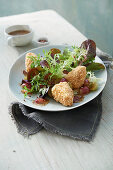 Red lamb's lettuce with nut-coated Brie, fried grapes and a fig-mustard dressing