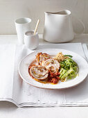 Schnitzel rolls with spicy halloumi filling and savoy cabbage