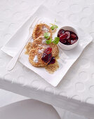 Sweet quark pancakes in a crunchy coating with red grapes