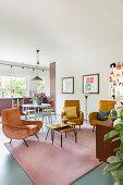 Retro armchair in open-plan interior in warm shades