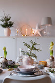 Dining table festively set in shades of grey