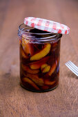 Roasted damsons in a screw-top jar