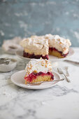 Louise cake with plum, coconut and meringue (New Zealand)
