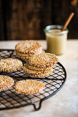 Tahini and sesame cookies on a cooling rack