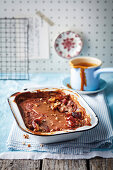 Date and nut pudding with toffee sauce (England)