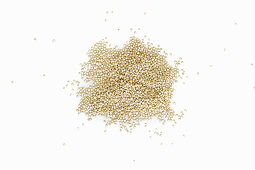 A heap of quinoa on a white background