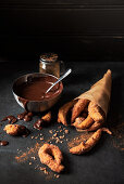 Churros with sugar cinnamon and dark chocolate sauce for dipping