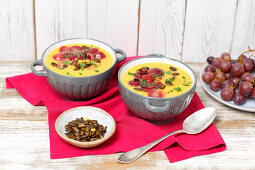 Pumpkin cream soup with grapes
