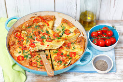 Potato tortilla with courgette and cherry tomatoes