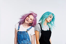 Two young women with pink and blue hair