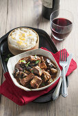 Braised beef with ale and mushrooms served with threecheese mashed potato