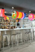 Colourful rubber rings above counter in bar