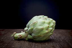 Artichoke on a Wooden Board