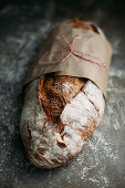 Rustic bread loaf on dark background