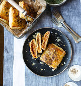 Minced meat puff pastry parcels served with yoghurt and dukkah spice