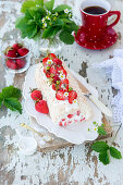 Meringue roll with strawberries and coconut