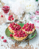 Raspberry and pistachio tarts