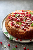 Upside down apple and walnut cake with redcurrants