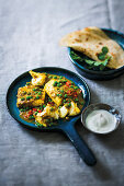 Coconut fish and pea curry