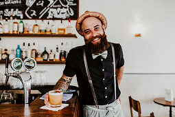 A man with a beard at a bar (Grande Café & Bar, Zurich, Switzerland)