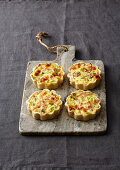Mini ham and cheese tartlets with spring onions