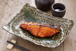 Teriyaki salmon served alongside Sake