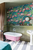 Flamingo-patterned wallpaper and wainscoting in bathroom