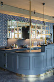 Open-plan, bar-style kitchen with grey panelled front