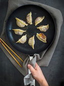 Fried gyoza (dumplings, Japan) in a pan