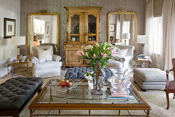 Large mirrors and antique cabinet in classic living room