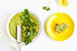 Italian Parsley and Lemon Pesto served in a ceramic bowl with sourdough bread