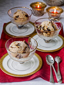 Prune Ice cream in glass dishes with candles
