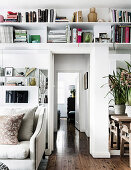 High shelves above the passage from the living room to the hall