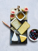 Various cheeses with figs and berries