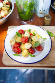 Potato salad with sesame seed pesto, tomatoes and mini mozzarella