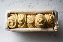 Raw uncooked dough for cooking swirl bread loaf with cocoa