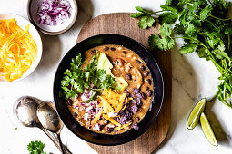 Chicken Chili in a black bowl on a white background