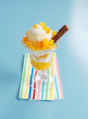 A peach and vanilla ice cream sundae