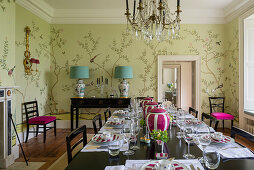Wallpaper in dining room with French crystal chandelier