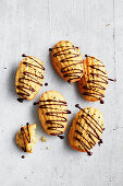 Coconut and sesame madeleines with choc drizzle