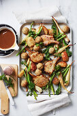 Cheat’s roast pork tray bake with stuffing balls