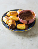 Orange madeleines with chocolate dipping sauce