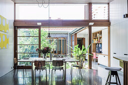 Dining table with chairs in front of sliding patio door