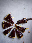 Salted caramel macadamia tart with chocolate ganache