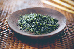 Loose green tea on a plate
