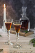 Two glasses of herbal liqueur