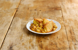 Brioche pudding with apple and caramel on a plate