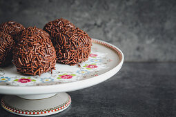 Chocolate rum truffles on a vintage cake stand